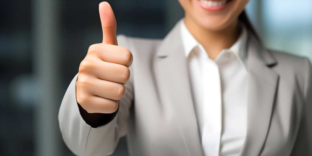 Woman giving thumbs up for positive feedback on product or servi